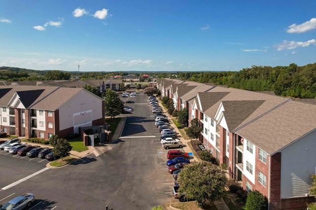 Aerial view of apartment buildings and parking lot