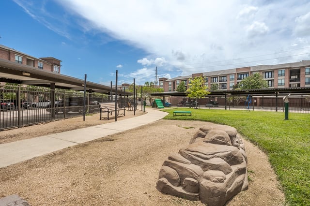 Covered parking and a dog park with agility equipment.