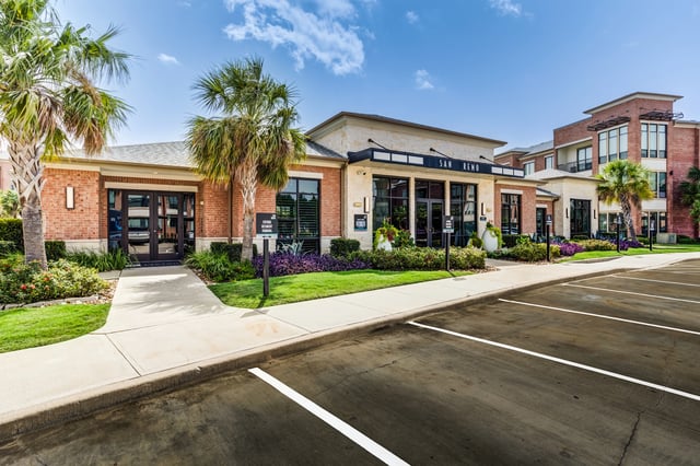 San Remo apartment complex entrance and parking lot.