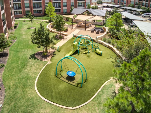 Playground with swings, slides, and tunnels.