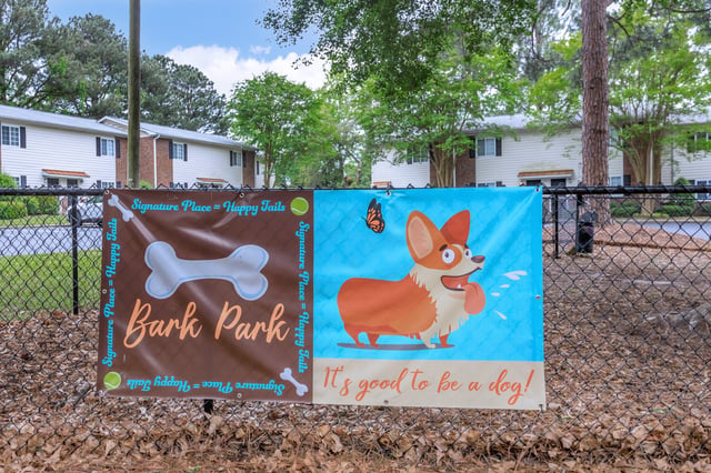 Bark Park sign with a corgi and a bone graphic
