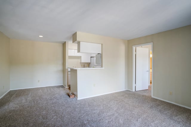 Living room and kitchen area of an apartment.