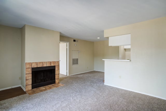 Living room with fireplace and pass-through to kitchen