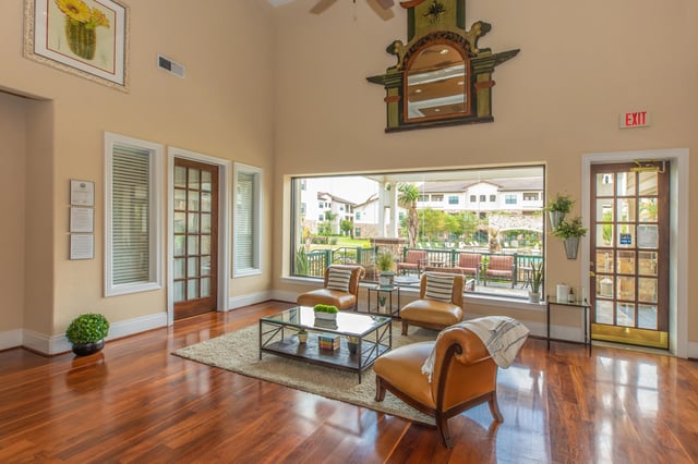 Lobby with seating area overlooking pool and courtyard