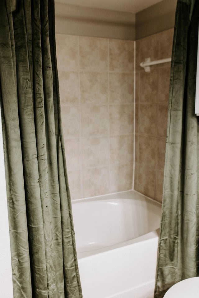 Bathroom with bathtub and shower curtain