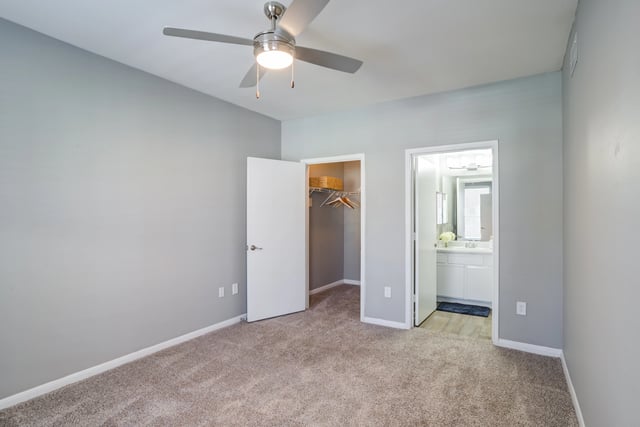Bedroom with ceiling fan and access to closet and bathroom.