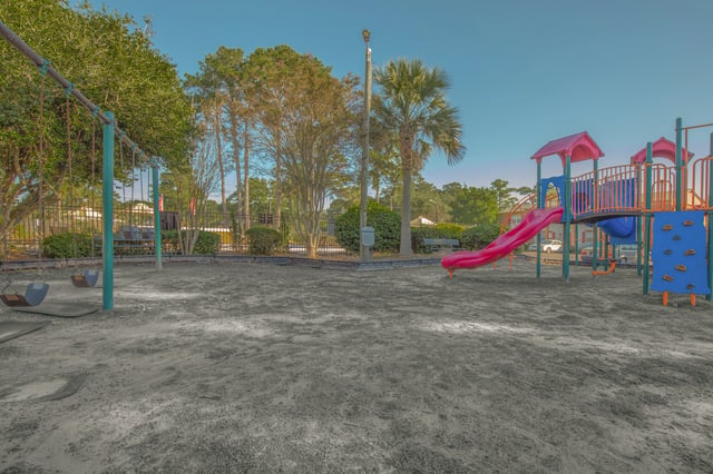 Playground with swings and a slide.