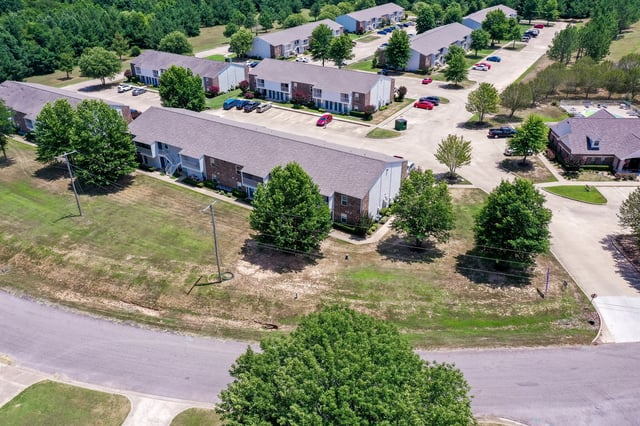 Aerial view of apartment buildings and parking lots