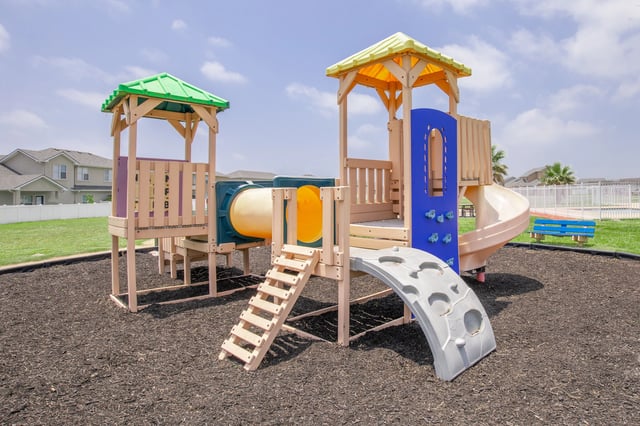 Playground equipment with slides and tunnels.