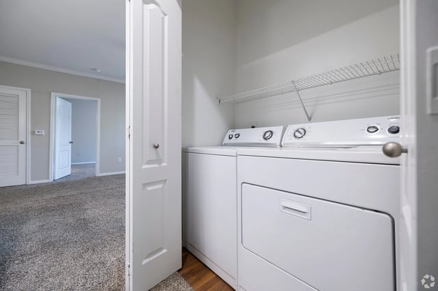 In-unit washer and dryer stacked in a closet