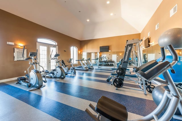 Fitness center with cardio machines and free weights