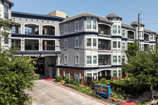 The Jaxon Premier Apartments building exterior with a signage.