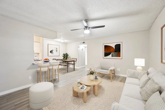 Living room and dining area with modern furniture and decor.