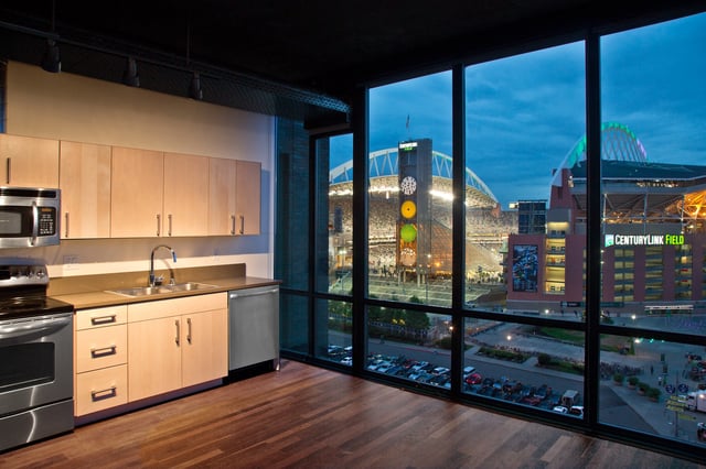 Modern apartment kitchen with stadium view