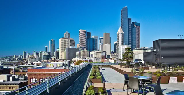 Rooftop seating area with city skyline view