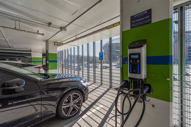 Electric vehicle charging station in parking garage