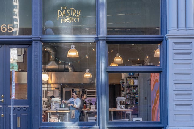 Two women baking in a professional kitchen at The Pastry Project.