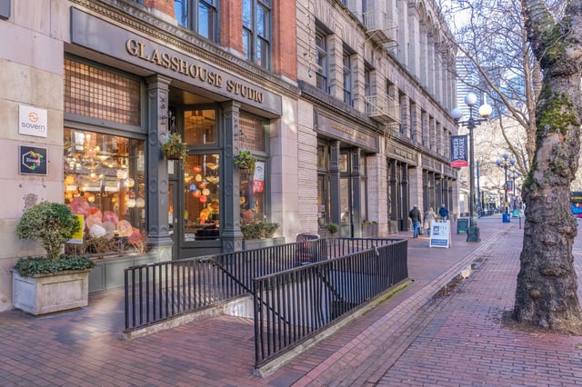 Exterior view of a historic building with shops at street level in Pioneer Square.