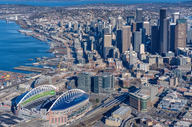Aerial view of downtown Seattle, showcasing Lumen Field and the city skyline.