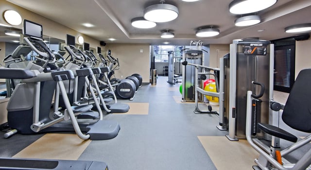 Well-equipped fitness center with cardio and weight machines.
