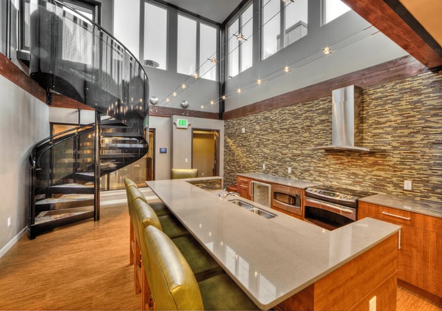 Kitchen island with bar seating and a spiral staircase.