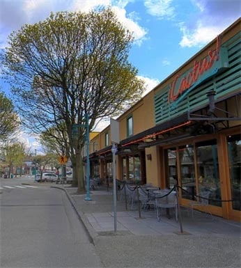 Street view of Cactus restaurant with outdoor seating and trees.