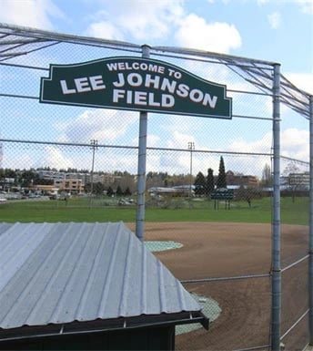 Welcome to Lee Johnson Field sign at a baseball park.