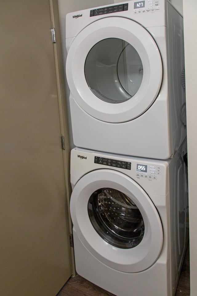 Stackable Whirlpool washer and dryer unit.