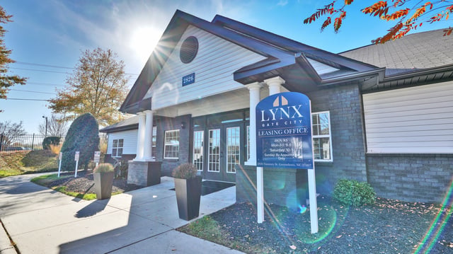 Lynx Gate City leasing office entrance with signage and landscaping.