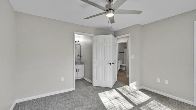 Bedroom with a ceiling fan and access to bathrooms.