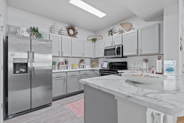 Interior view of a closet with shelving and baskets.