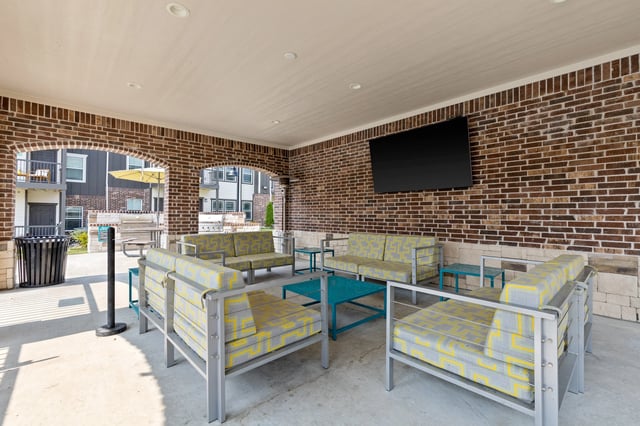 Outdoor lounge area with patterned chairs and table