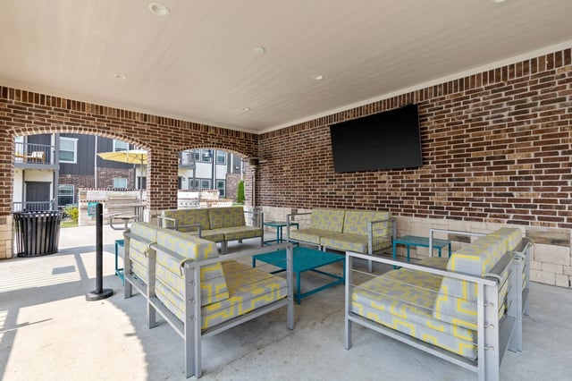 Outdoor lounge area with patterned chairs and table