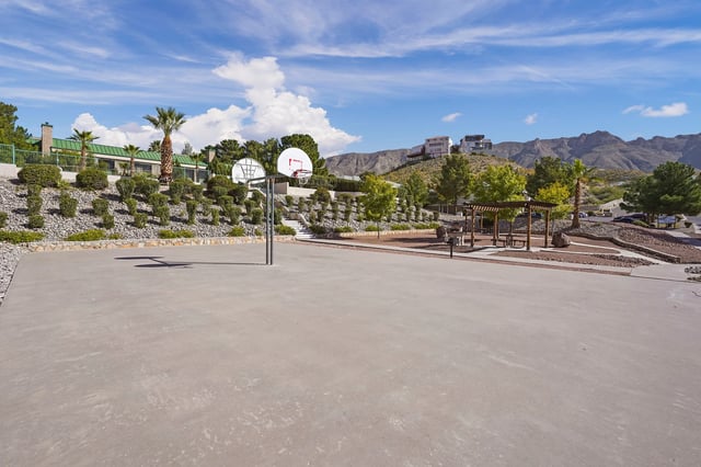 Outdoor basketball court with mountains in the background