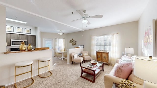 Open concept living area and kitchen with bar seating.