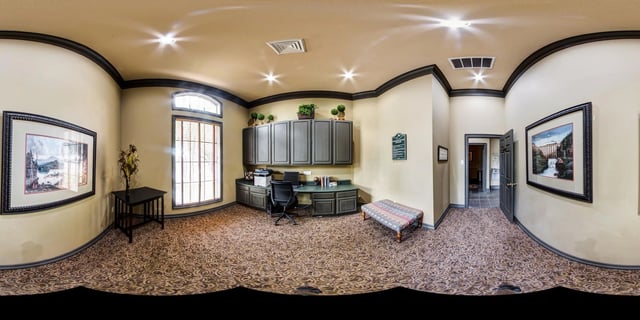 Office area with desk, computer, and cabinets.