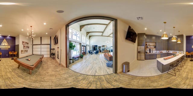 Artisan Crossing communal kitchen and entertainment area with pool table and seating.