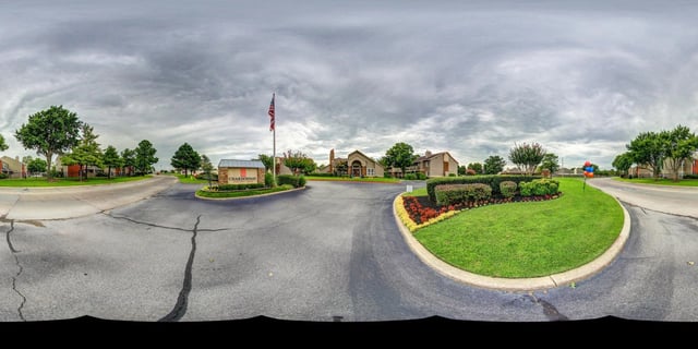 Chardonnay apartment complex entrance sign and landscaping.