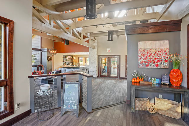 Interior common area of a multifamily property with a coffee bar and seating area.
