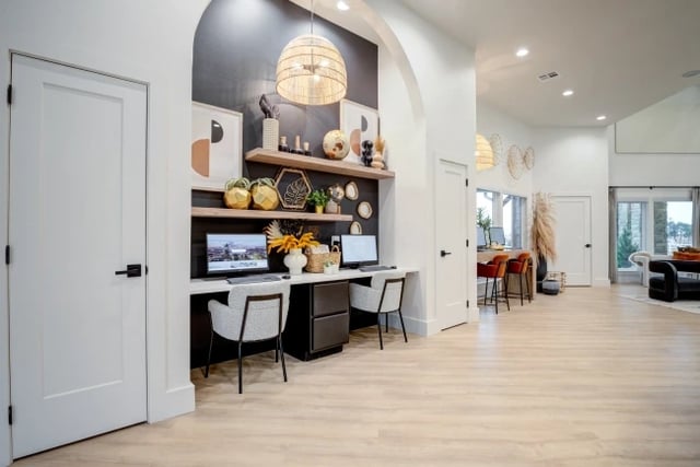 Business center with dual computers and seating