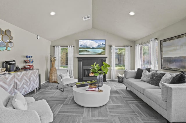 Comfortable lounge area with a fireplace, seating, and coffee bar.