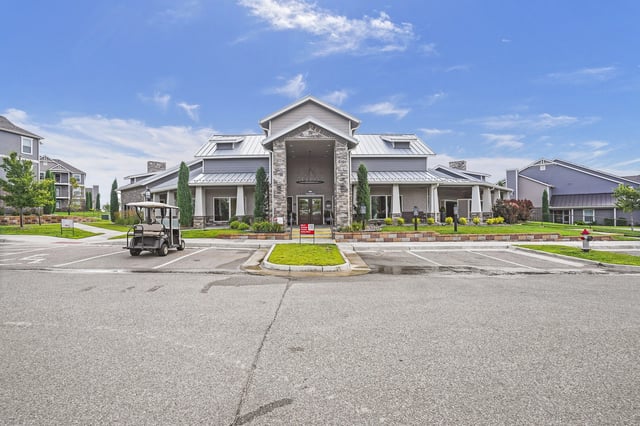 A large house with a driveway in front of it.