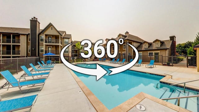 360 tour of community swimming pool with lounge chairs and apartment buildings in background.