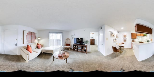 A living room and kitchen area in a multifamily property.