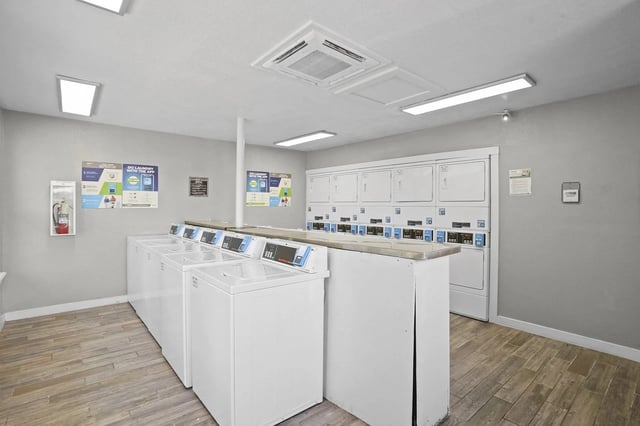 Laundry room with washers and dryers.