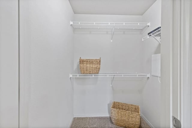 Closet with shelves and wicker baskets