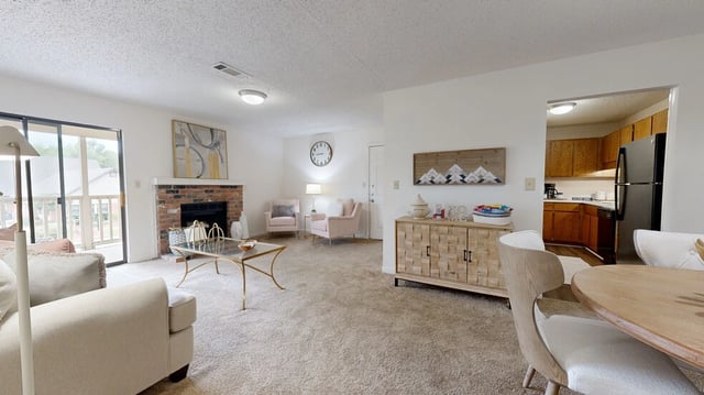 Living room with fireplace and dining area