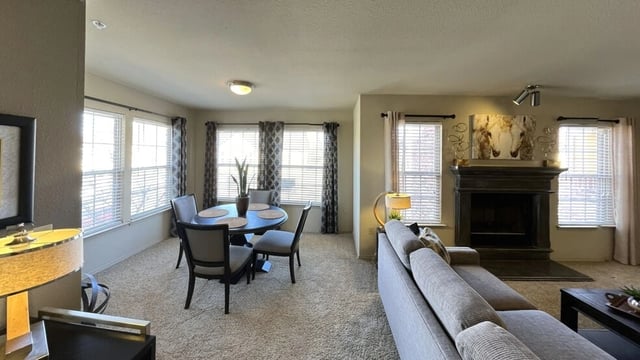 Living room and dining area with fireplace
