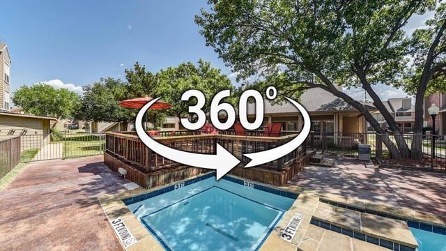 Community swimming pool and sundeck area with lounge chairs and umbrellas.
