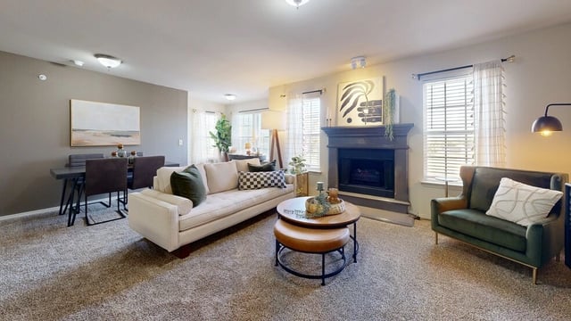 Living room and dining area with fireplace
